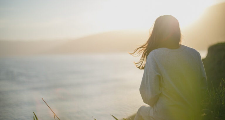 Girl watching a beautiful sunrise