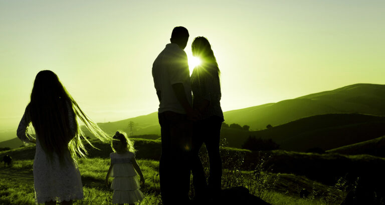 Family watching sunrise
