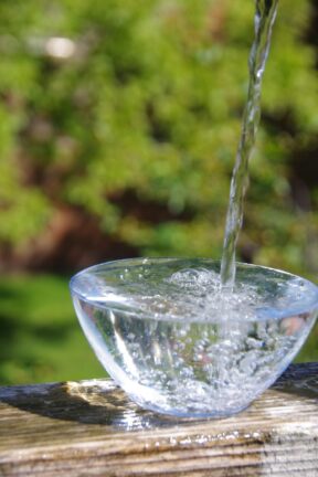 Water pouring into a glass